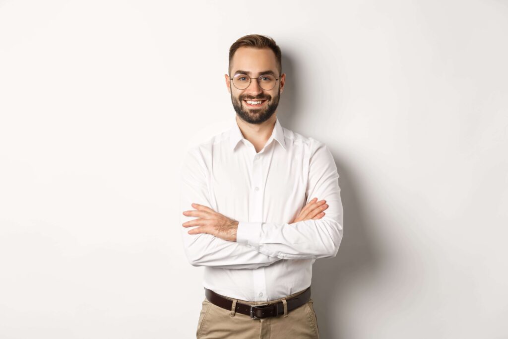 business-young-professional-businessman-in-glasses-smiling-at-camera-cross-arm-on-chest-with